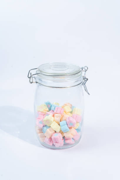 istock Machmallow colorful in glass on white blackground 1413452756