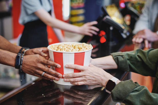 istock People Buying Popcorn At Cinema 1413453445