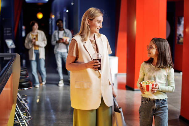 istock Mom And Daughter Going To Cinema 1413453537