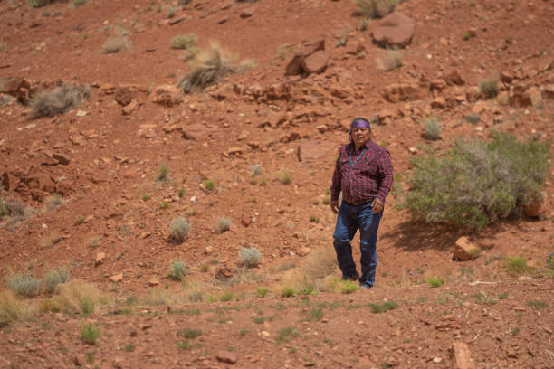 istock Man walking on desert in Utah, Monument Valley 1413453890