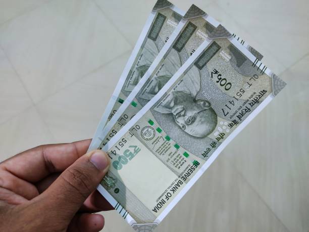istock Indian rupees note currency in hand and in wallet HD 1413455165