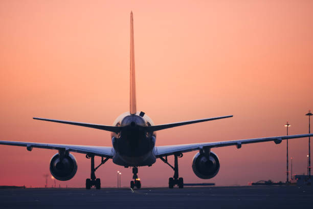 istock Airplane taxiing to runway at dawn 1413455231