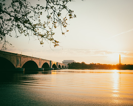 View of the Arlington Memorial Bridge and Lincoln Memorial at dawn with Potomac River in Washington DC
