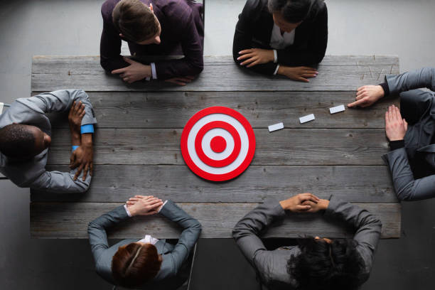 istock Business people pointing at red target 1413459075