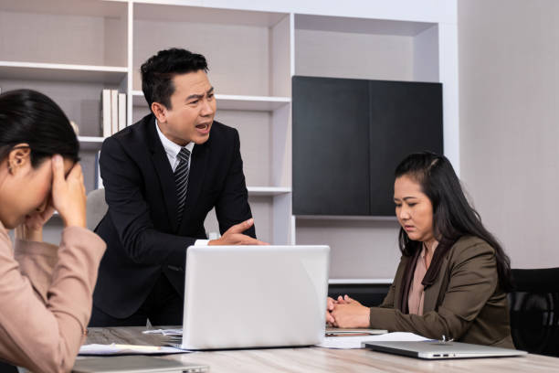 asian men manager scold and angry with their employee inside of office meeting room with upset and stress worker. business failure. problem in working office, negative emotion workplace. - rudeness manager emotional stress asian ethnicity imagens e fotografias de stock