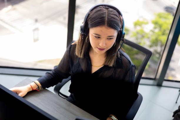 istock Beauty woman working in a callcenter 1413466116