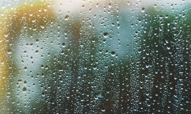 istock Sun after rain. Drops on glass. It's been raining. Texture on glass. 1413466922