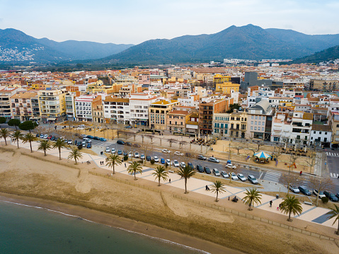 Aerial view of sand beach and city Roses, Catalonia
