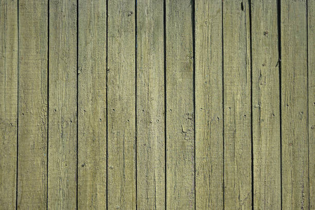 istock green board fence with damaged paint from the environment 1413469516