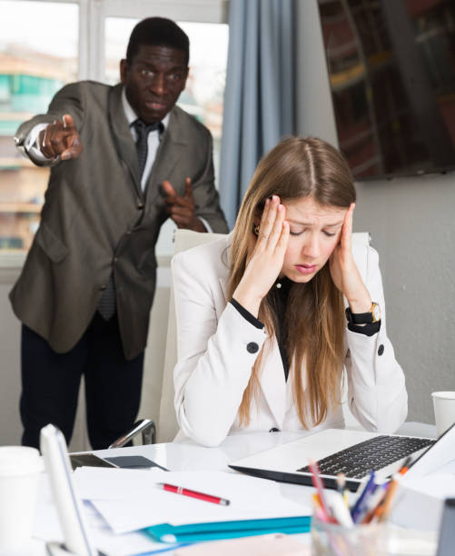 istock Upset woman with angry boss 1413470972