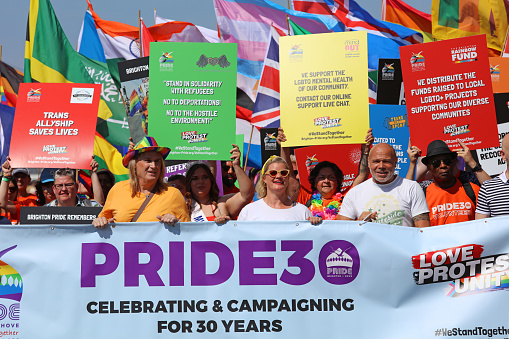 Brighton, England - August 6th 2022: One of the UK's most significant pride events is celebrating its 30th anniversary. Brighton & Hove Pride is intended to celebrate, and promote respect for, diversity and inclusion within the local community and support local charities and causes through fundraising. 
Brighton’s Preston Park was filled with rainbows and glitter, as thousands of people joined the party to celebrate the 30th anniversary of Brighton & Hove Pride. The festivity saw a crowd of around 400,000 people coming together loud and proud on the streets of Brighton and inside the park to celebrate We Are Fabuloso.