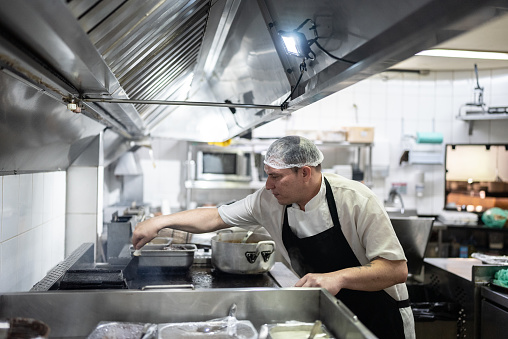 Interior shot of a professional restaurant's kitchen. New stainless steel commercial kitchen.