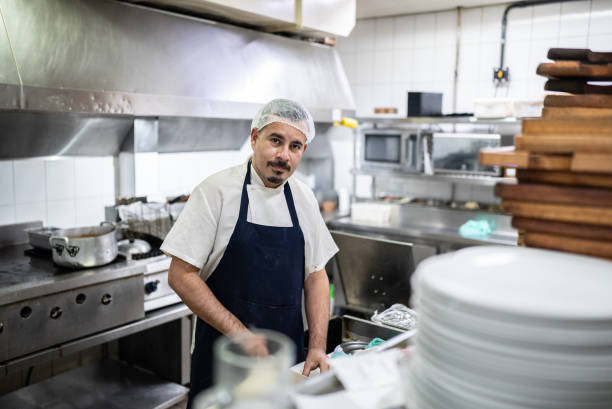 istock Portrait of a chef working in a commercial kitchen 1413473584