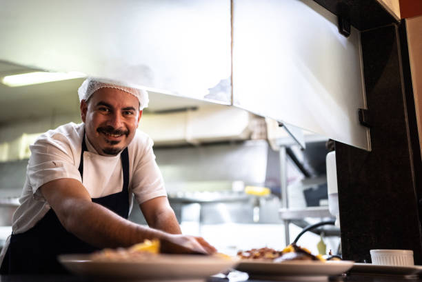 istock Portrait of a chef putting orders on the counter 1413473861