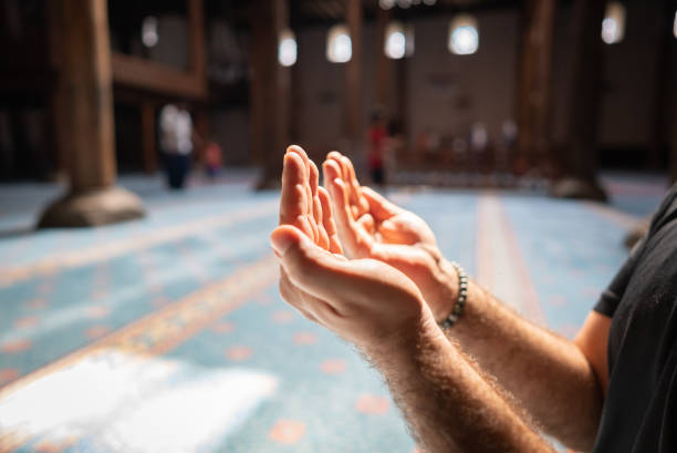 istock Muslim people praying in mosque 1413475500