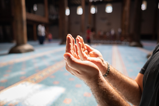 Muslim people praying in mosque