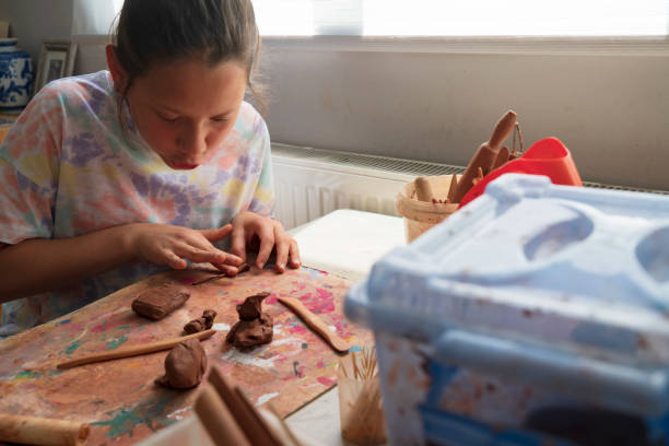 istock Children hands molding clay at home 1413476610