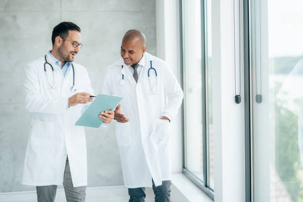 istock Two doctors talking at hospital 1413477528