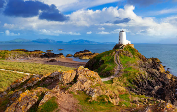 Twr Mawr on Llanddwyn Island, Anglesey, UK, in evening light under a nicely clouded sky