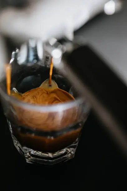 Photo of Coffee espresso pouring into white cup