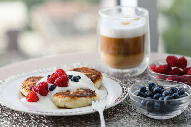 istock Cottage cheese pancakes with blueberries and raspberries. 1413479022