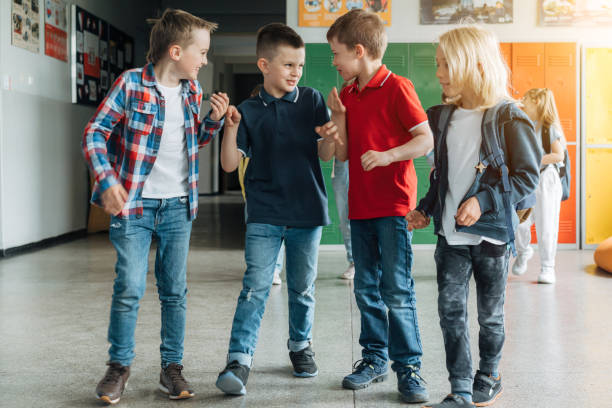 istock Group of elementary school boys walking after school 1413479085