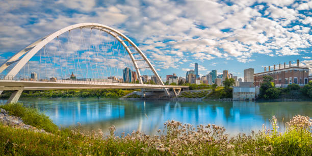 istock Edmonton cityscape and Walterdale Bridge over North Saskatchewan River in Alberta, Canada. Sunrise river trail landscape and cloudscape at Queen Elizabeth Park. 1413479228