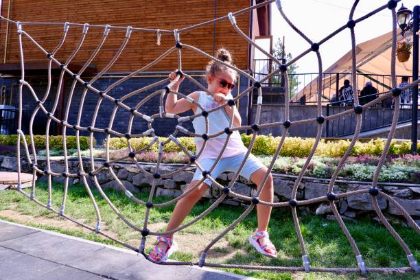 little girl is playing in the park