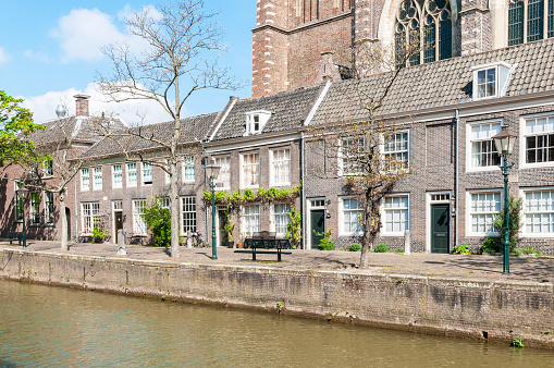 Typical Dutch houses at the edge of the canal, in Dordrecht, a town in Southern Netherlands.
