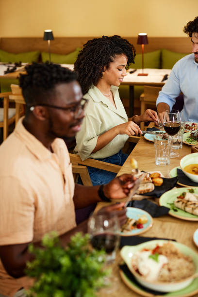 istock Happy friends have a dinner party at the restaurant. 1413488676