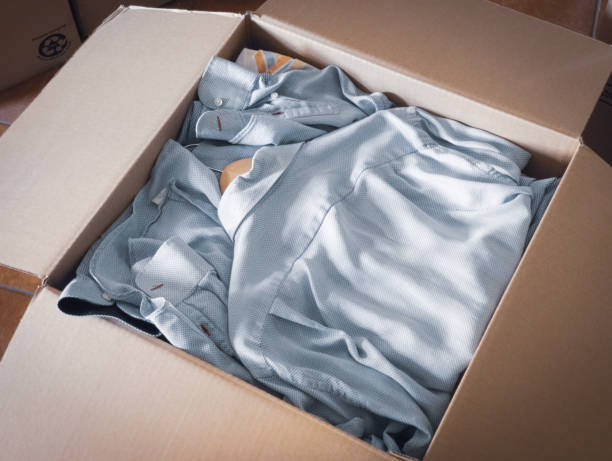istock packing the shirts for the removal 1413490074