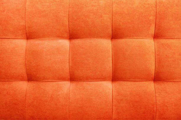 istock Orange suede leather background, classic checkered pattern for furniture, wall, headboard 1413493433