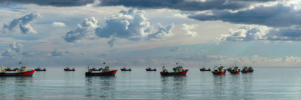 istock fishing boat in the sea 1413496975