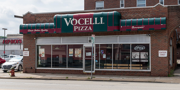 Pittsburgh, Pennsylvania, USA August 7. 2022 The Vocelli Pizza shop on Baum Boulevard in the Shadyside neighborhood on a summer day