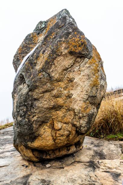 Ishage Rock Ishage Rock is a large elongated boulder of rock, balanced and standing upright on one of its small edges. According to legend, this rock had never fallen off the steep side of the mountain where it rests. oyo state stock pictures, royalty-free photos & images
