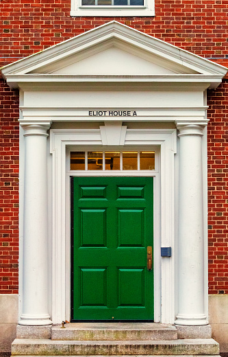 Cambridge, Massachusetts, USA - January 19, 2022: Eliot House building A entrance door. Eliot House (c. 1931) is one of the twelve undergraduate residential Houses at Harvard University.