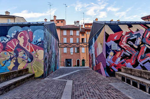 Bologna, Italy - July 9, 2022: Street art in the early morning on a Bologna pathway
