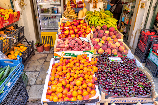 Corfu, Greece - July 19, 2022: Fruit stand on the busy streets of Corfu Greece