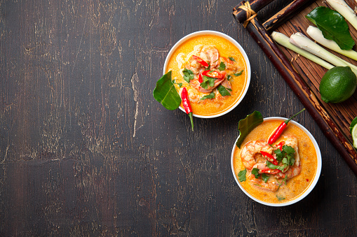 Tom Yam Kung ,Prawn and lemon soup with mushrooms, thai food in two white bowl top view