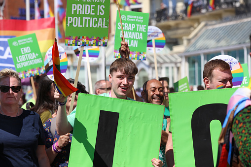 Brighton, England - August 6th 2022: Green Party of England and Wales is at the Brighton & Hove Pride parade. \n\nOne of the UK's most significant pride events is celebrating its 30th anniversary. Brighton & Hove Pride is intended to celebrate, and promote respect for, diversity and inclusion within the local community and support local charities and causes through fundraising.