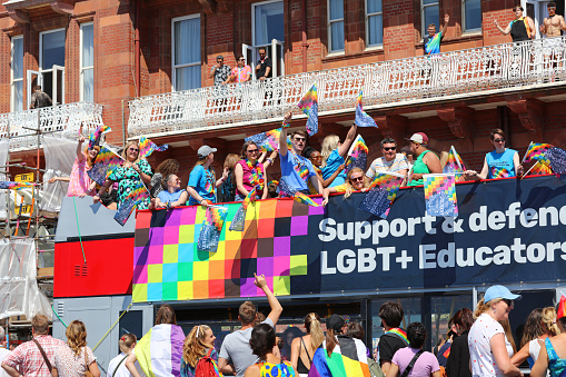 Brighton, England - August 6th 2022:  National Education Union at the Brighton & Hove Pride parade.\nOne of the UK's most significant pride events is celebrating its 30th anniversary. Brighton & Hove Pride is intended to celebrate, and promote respect for, diversity and inclusion within the local community and support local charities and causes through fundraising.