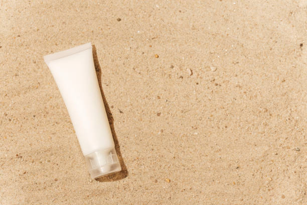 istock cosmetic bottle mockup on sand 1413515628