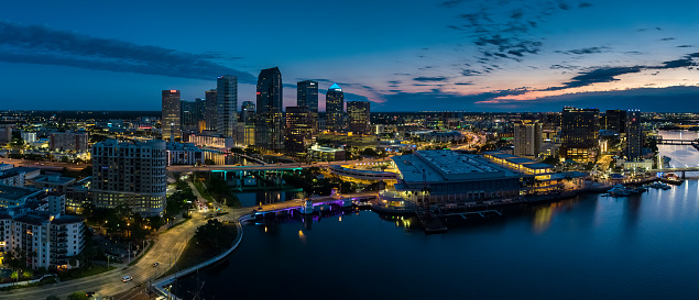 Panoramic drone shot of downtown Tampa, Florida at sunrise.