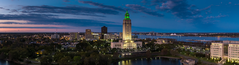 Panoramic drone shot of of the Louisiana State Capitol and downtown Baton Rouge, Louisiana at in pre-dawn twilight. 

Authorization was obtained from the FAA for this operation in restricted airspace.