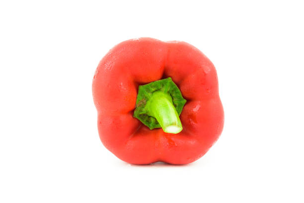 Bent, wonky, ugly looking red pointed peppers that supermarkets may refuse due to their unusual shape. Isolated on a white background with space for copy