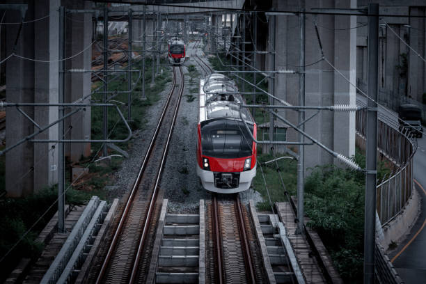 istock Railway station with modern red commuter train at colorful sunset 1413519465