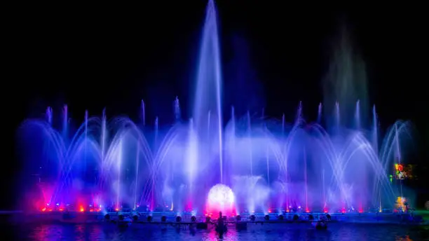 colored decorative dancing water jet led light fountain show at night