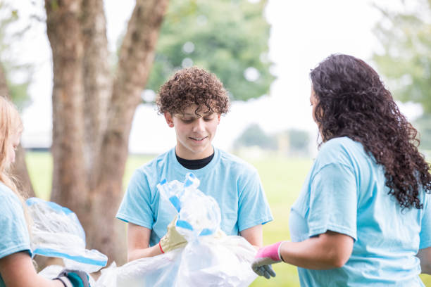 istock Teenage Boy holding garbage bag 1413520669