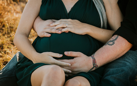 Maternity Photo Shoot of a couple embracing each other