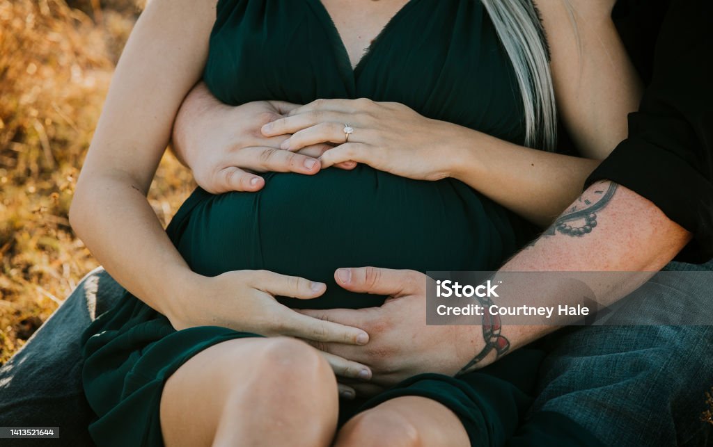 Maternity Photo Shoot of a couple embracing each other 20-24 Years Stock Photo